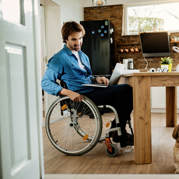 Man and Dog with laptop working