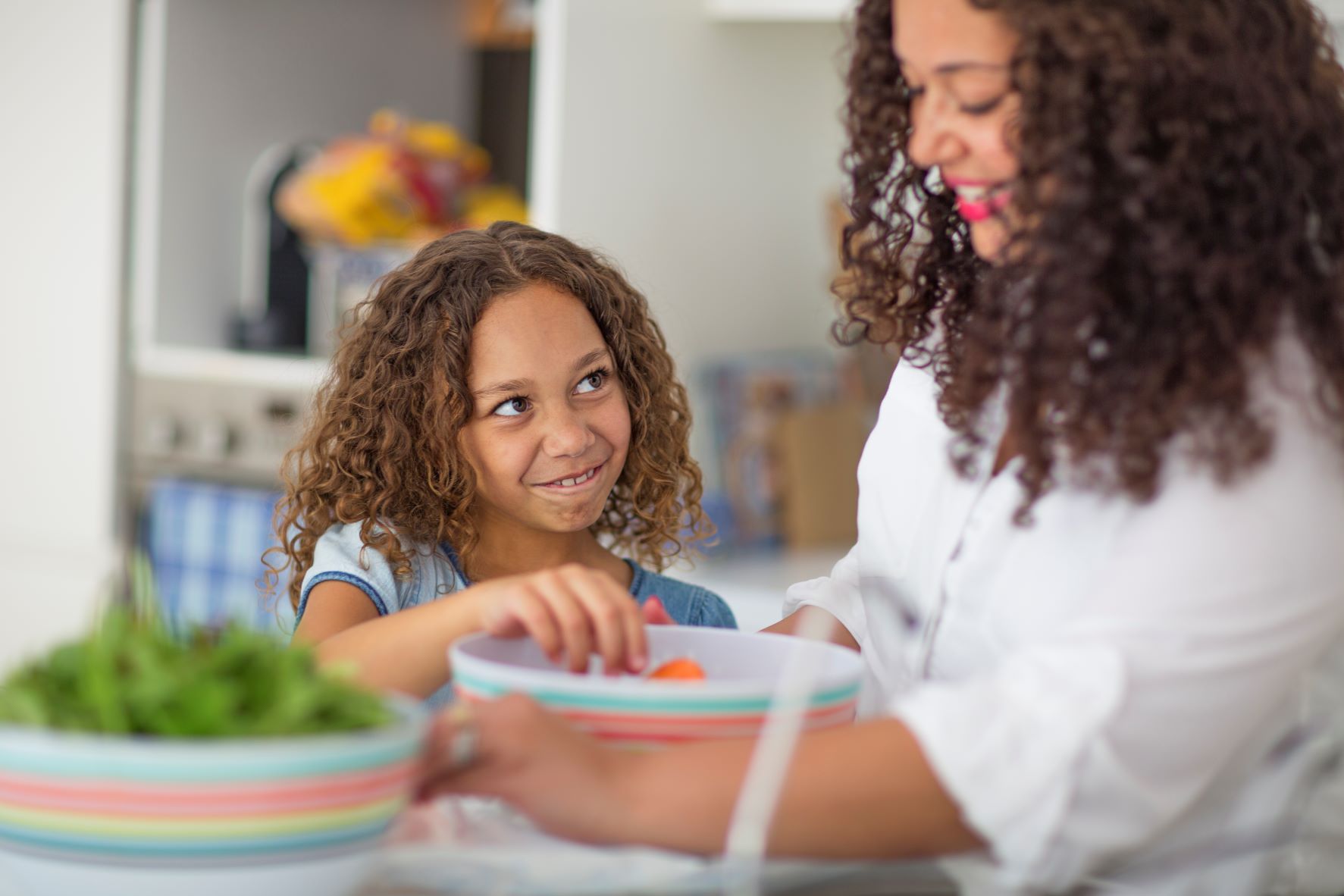 mother and young daughter in the kitchen
